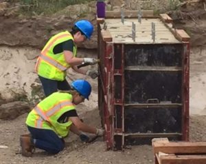 Kristin Del Belso, a seasonal sustainability coordinator at the state Parks, Recreation and Historic Preservation’s Albany Energy Bureau, and Claudia Jarzebiak, who also works at the agency’s Albany Energy Bureau, help build solar panels at Robert Moses State Park. (Photo provided)