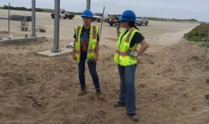 Claudia Jarzebiak, a CSEA member who works at the agency’s Albany Energy Bureau and Kristin Del Belso, a CSEA member and seasonal sustainability coordinator at the state Parks, Recreation and Historic Preservation’s Albany Energy Bureau, inspect their work on the solar array at Robert Moses State Park. (Photo provided)