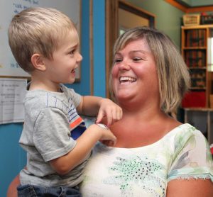 Brandt with a child at her Ulster County daycare.