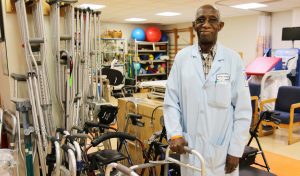 Patrick Duke with physical therapy equipment he uses to help patients.