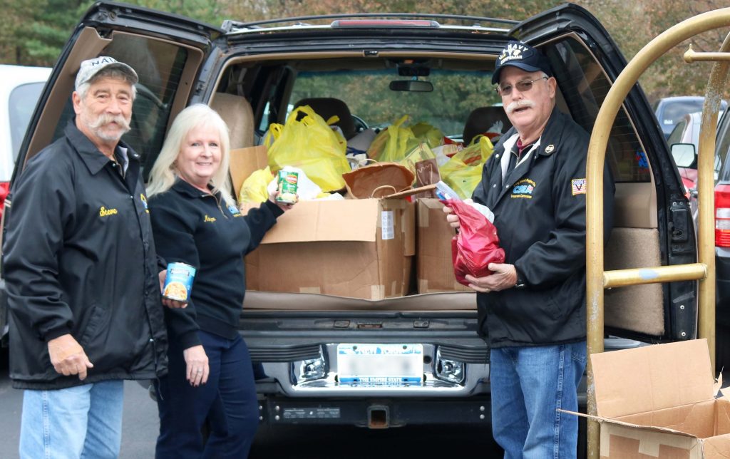 Steve Abramson, Veterans Committee Chair Maryann Phelps and Ed Hussey pack the many donations they received at the Nassau Educational Local career conference.