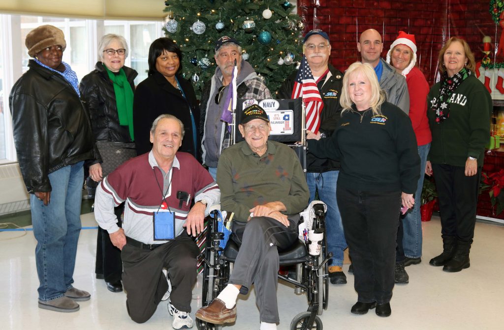 Long Island Region Veterans Committee members and guests enjoy the holiday decorations at the Long Island State Veterans Home. Back row, from left, Ruby Thomas, Eleanor Arnost, Evelyn McFarland, Steve Abramson, Ed Hussey, Meg Shutka and Lenore Rogers. Front row, from left, James Tullo, Long Island State Veterans Home resident Michael Geronimo and Veterans Committee Chair Maryann Phelps.