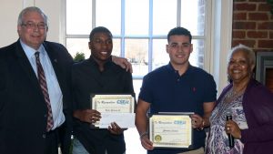 The scholarship recipients are presented with a certificate and scholarship award. From left, Nassau Local 830 President Jerry Laricchiuta, scholarship recipients Victor Garrison Jr. and Christian Castano and Unity Committee member Juanita McKinnies.