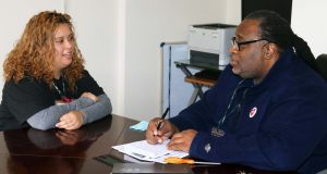 Maryory Sanchez speaks to Pilgrim Local President Rashad Jones at the CSEA local office about her experience working the first major snowstorm of 2018.