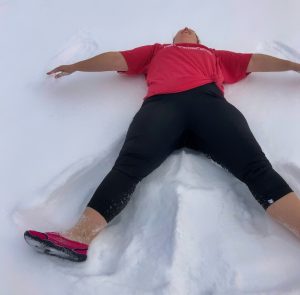 Western Region 2nd Vice President Carrie Asenato makes snow angels to support the Rochester Polar Plunge in a socially distanced manner.