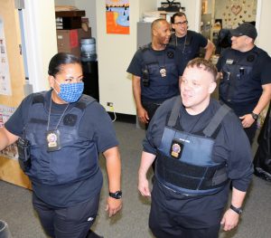The Nassau County Probation Team leaves to conduct a house search. Front row, Isabel Arroyo and Keith Moore, Second row, John Blalock and Hector Constain, back row, Matthew Rechner.