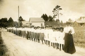 Mary McLeod Bethune stands with group of children, circa 1905.
