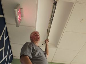 Person_working_on_ceiling_tile