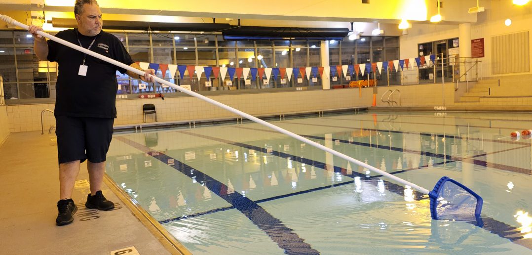 Person_cleaning_indoor_pool