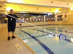 Person_cleaning_indoor_pool