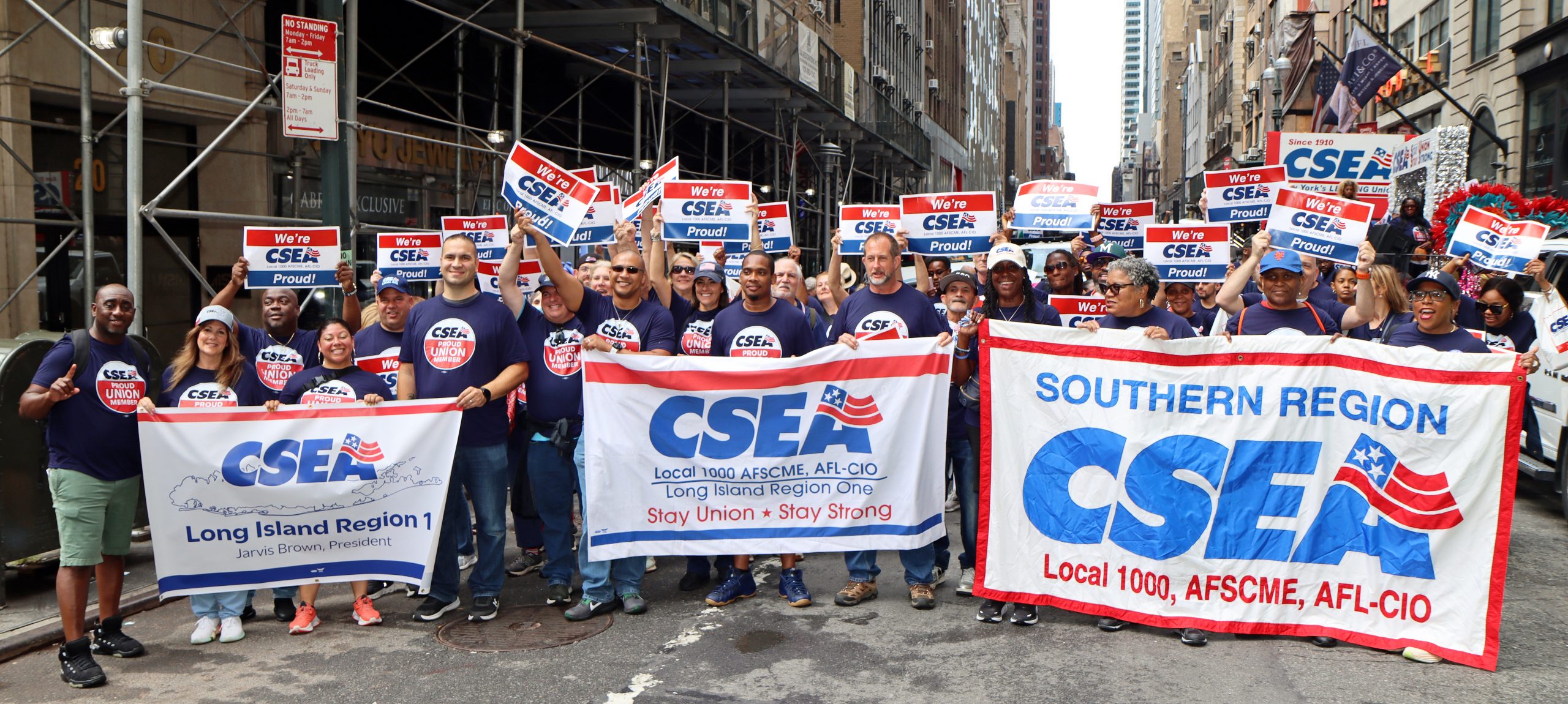 People_standing_outdoors_with_signs_and_banners