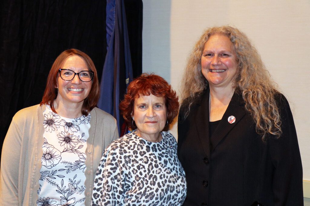 Three_women_standing_and_posing