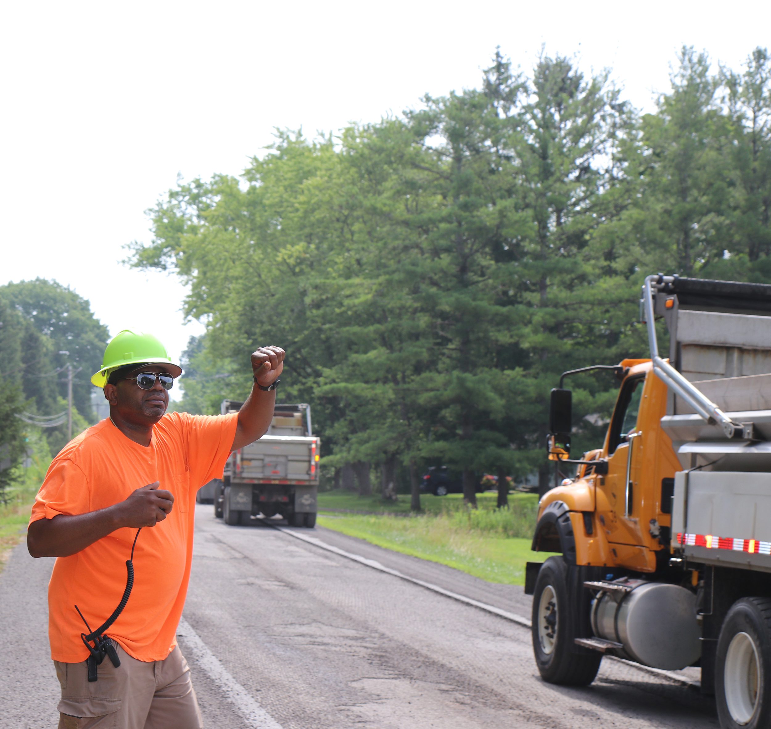 Man_working_on_highway_next_to_truck