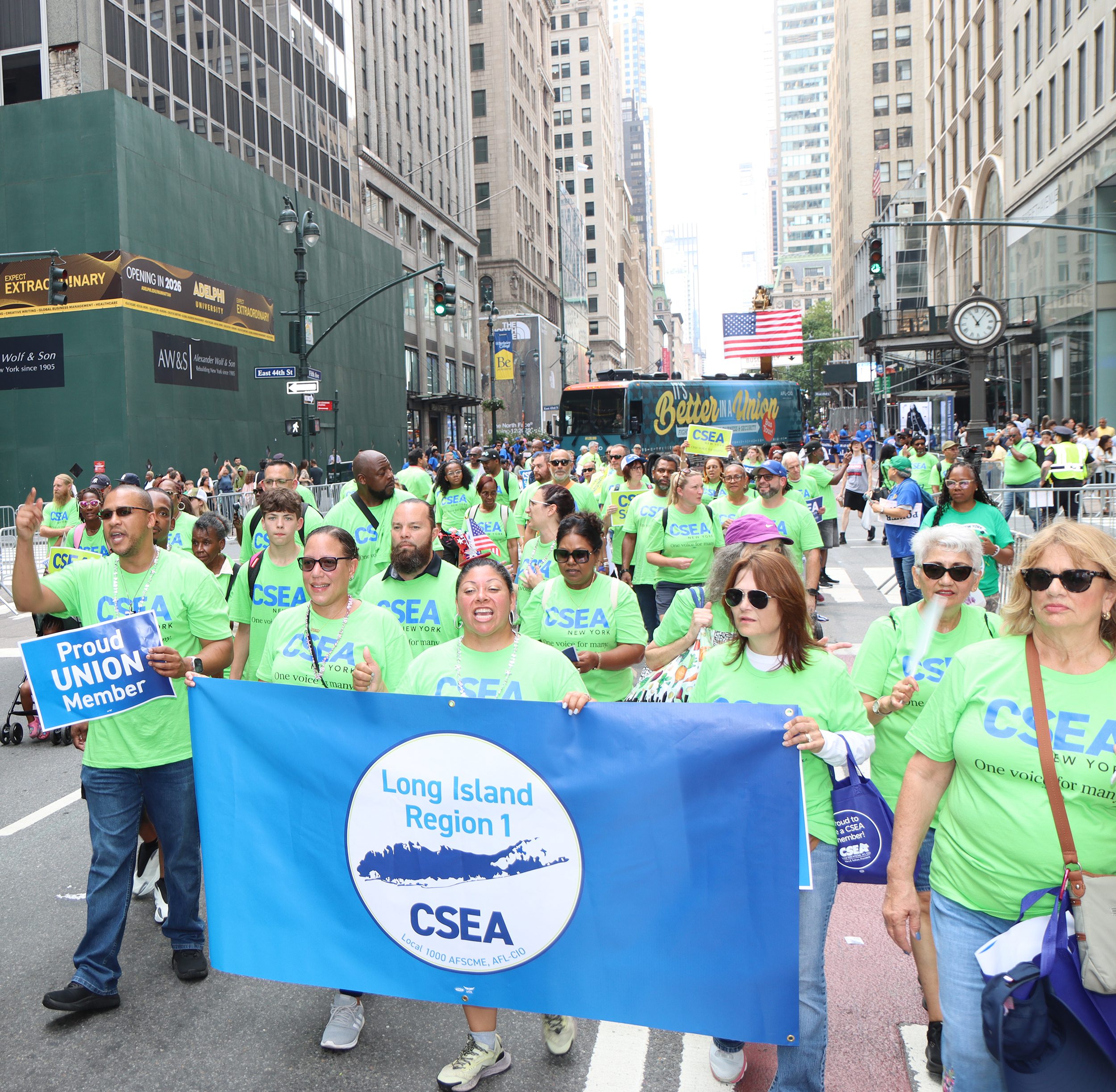 People_marching_behind_banner